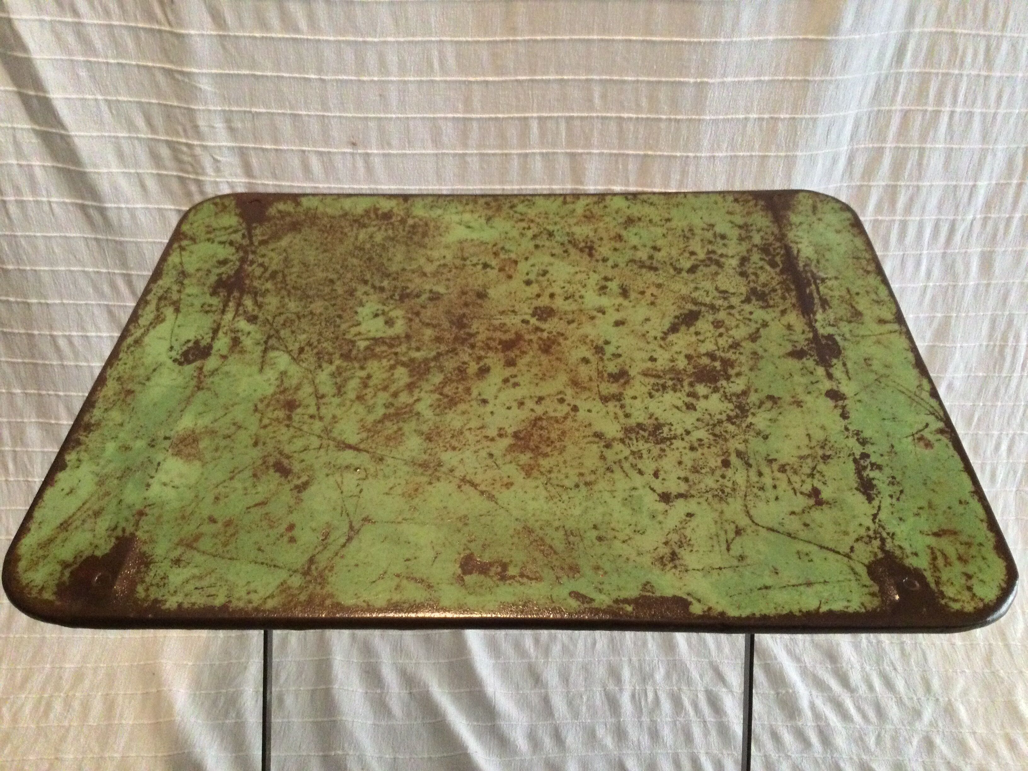Folding riveted iron table