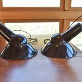 Pair of black enamelled sheet metal pendant lights from the 1950s.