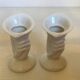 Paire de petits vases bougeoirs mains