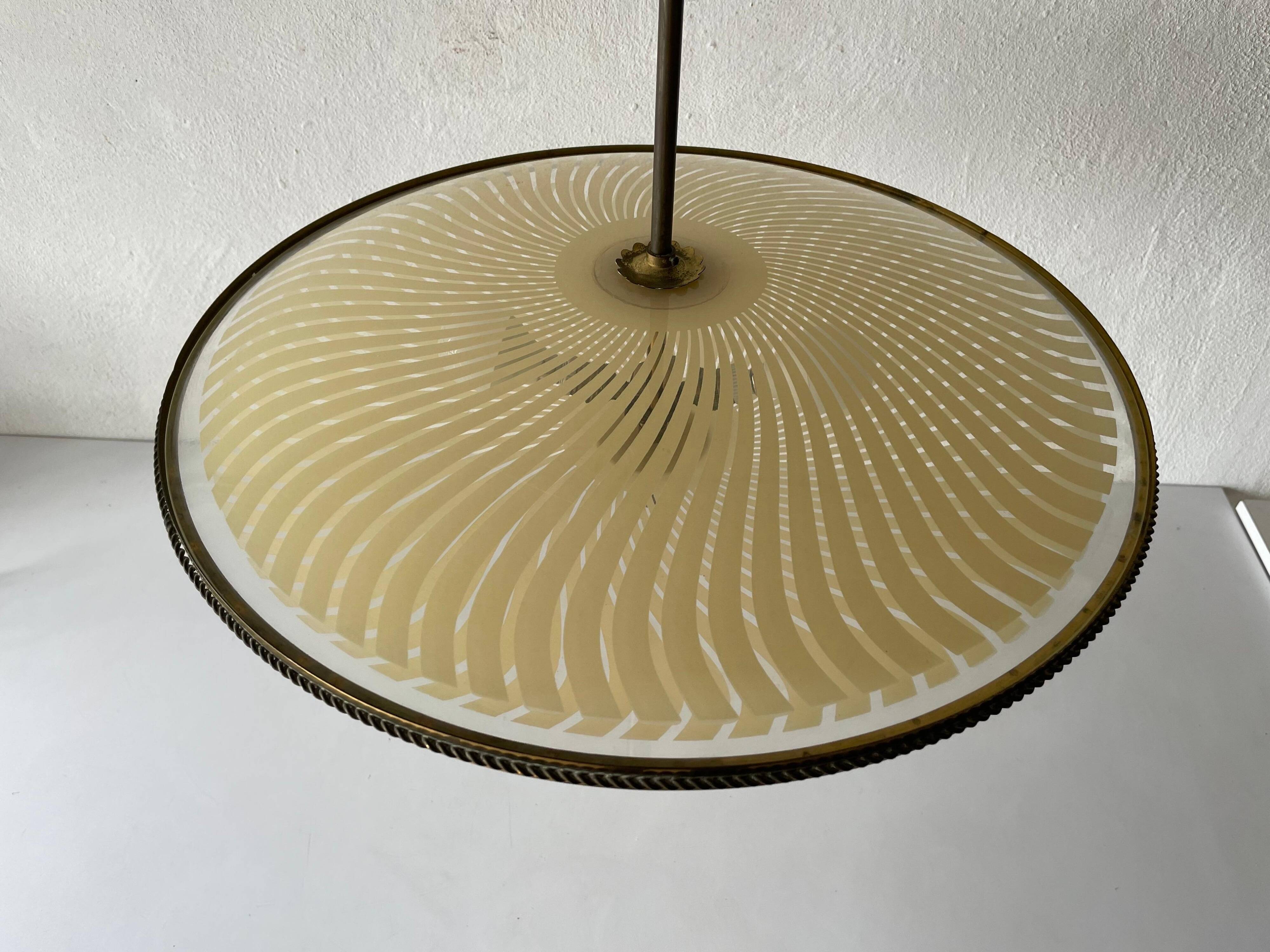 Large UFO design ceiling light in brass and printed glass, 1950s, Italy.