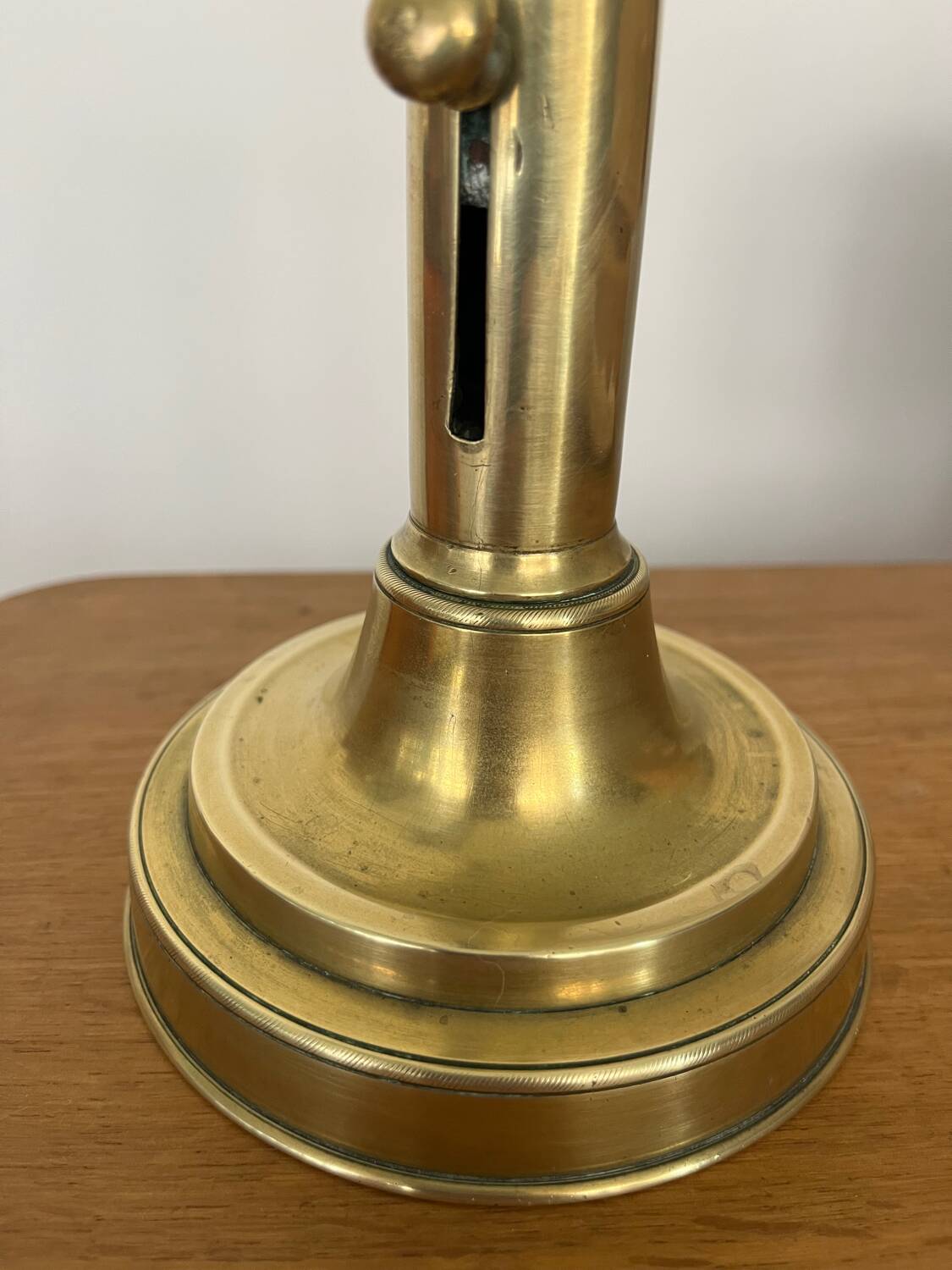 Antique brass push candle holder