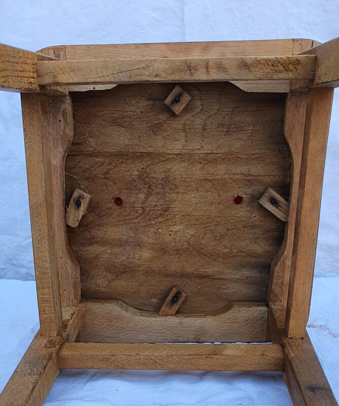 Vintage wooden stool and red skai seat