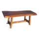 Rustic handcrafted coffee table with a mahogany top and elm legs.