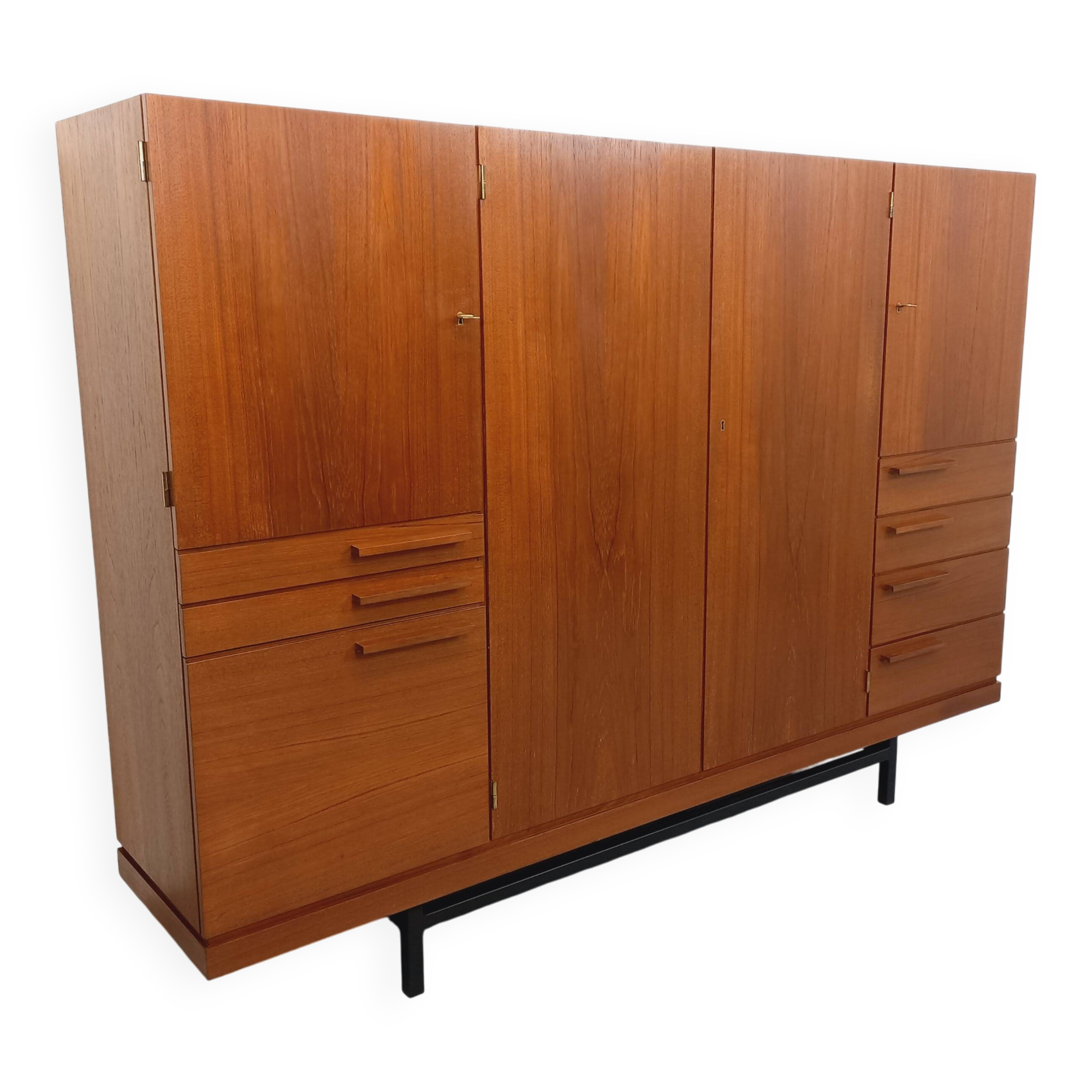 High Scandinavian modernist vintage sideboard in teak and black metal.