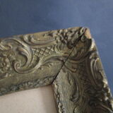 Bouquet of flowers with old wooden frame and gilded stucco