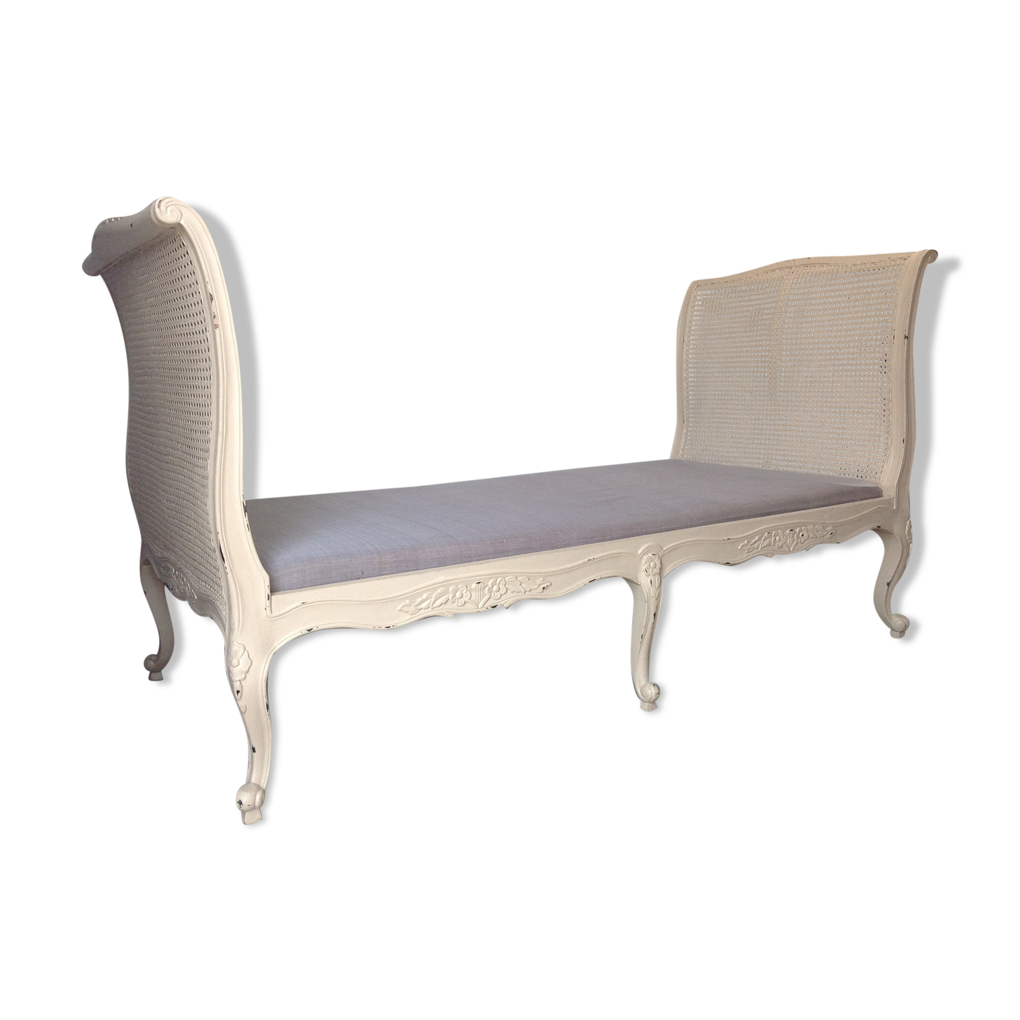 Carved wooden bench and caning bed