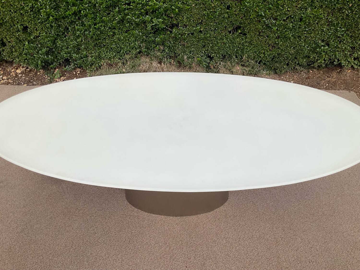 Oval designer dining table in frosted glass and brushed stainless steel