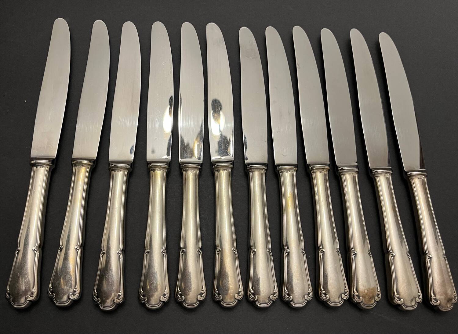 12 silver metal knives