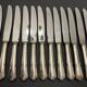12 silver metal knives