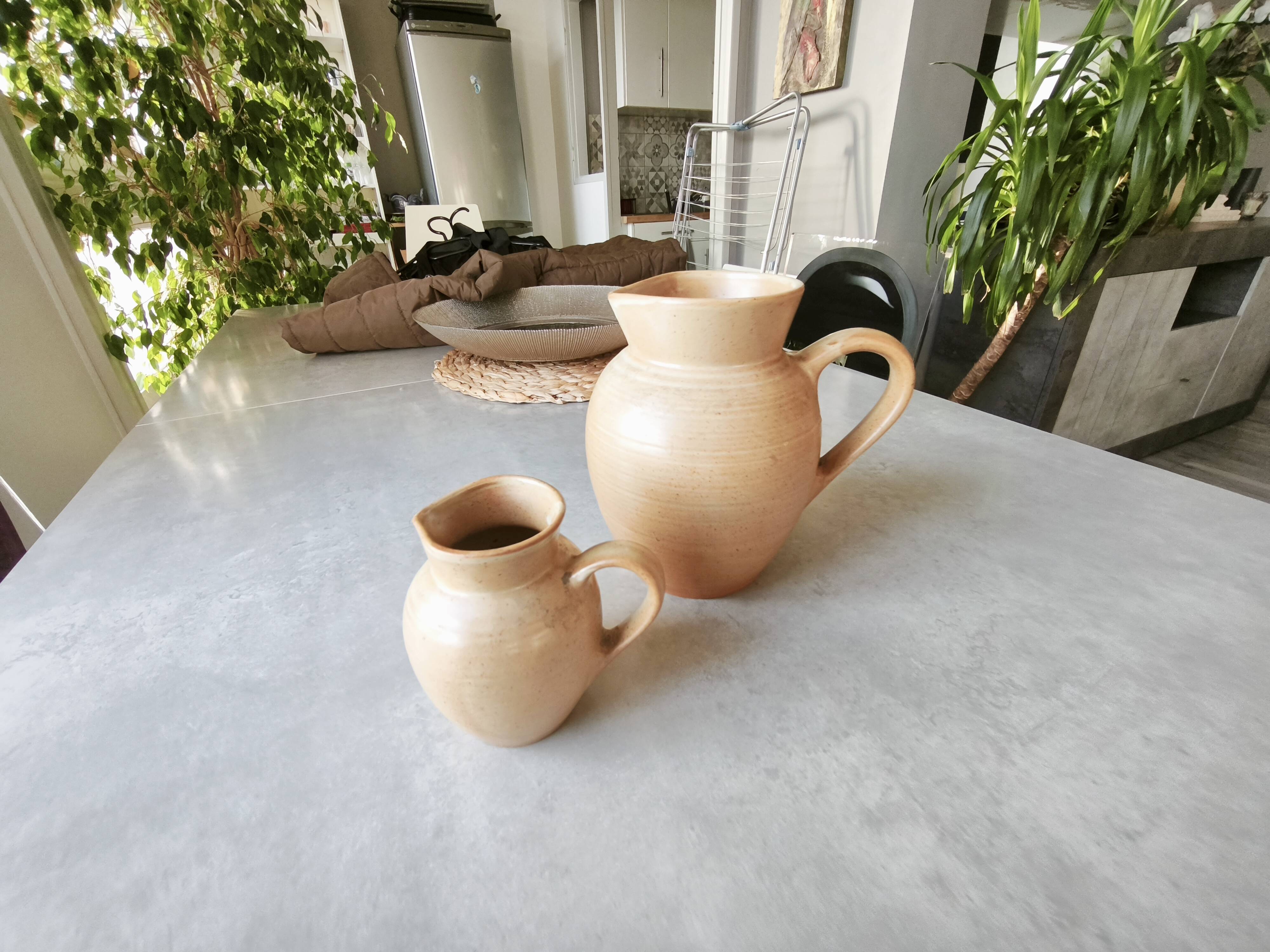 Set of two Village de France stoneware pitchers