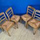 4 chaises de la marque Monobloc vers 1950. Paillage de couleur