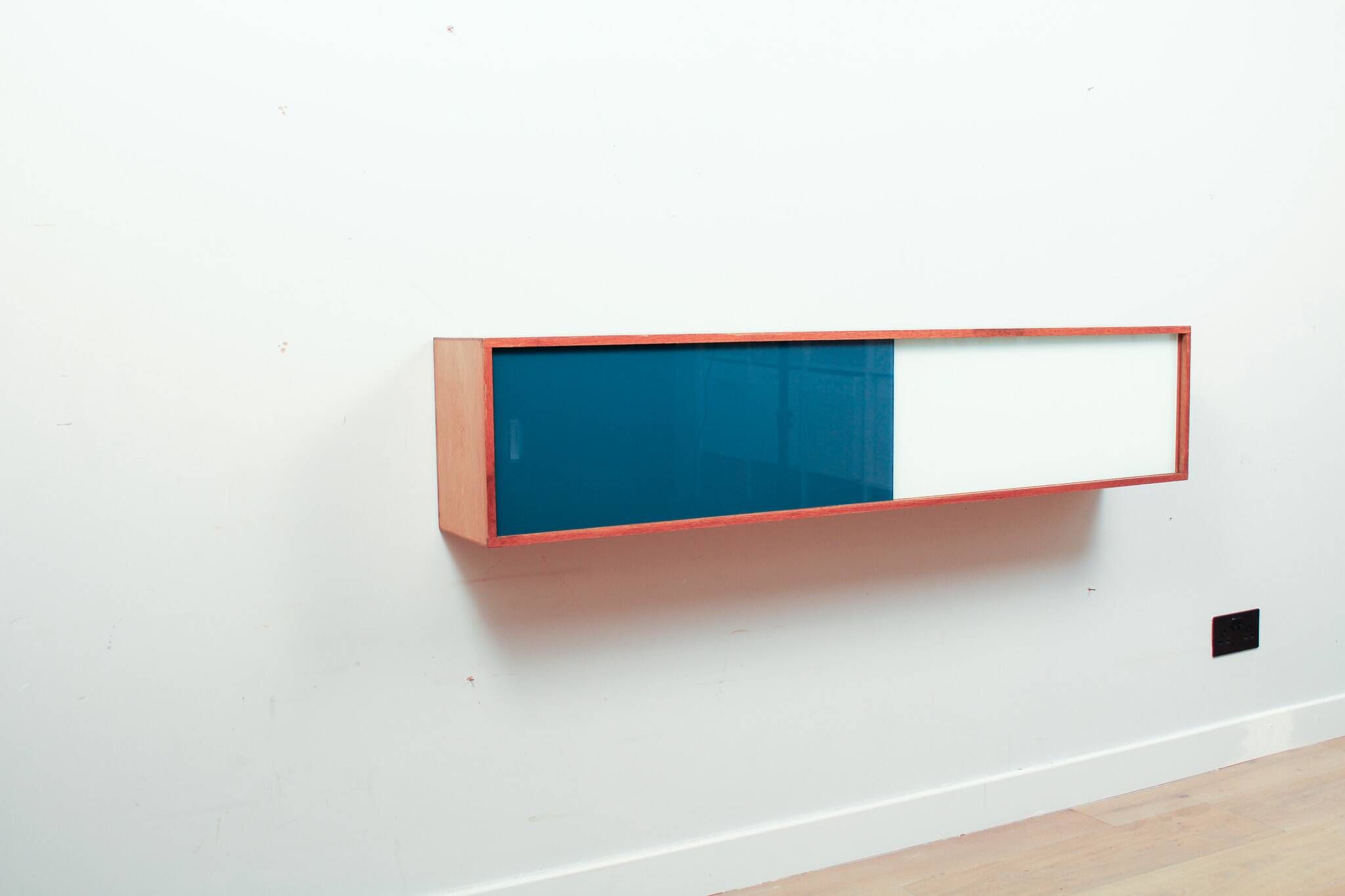 Vintage mid-century wall hung oak cabinets, blue & white sliding glass door