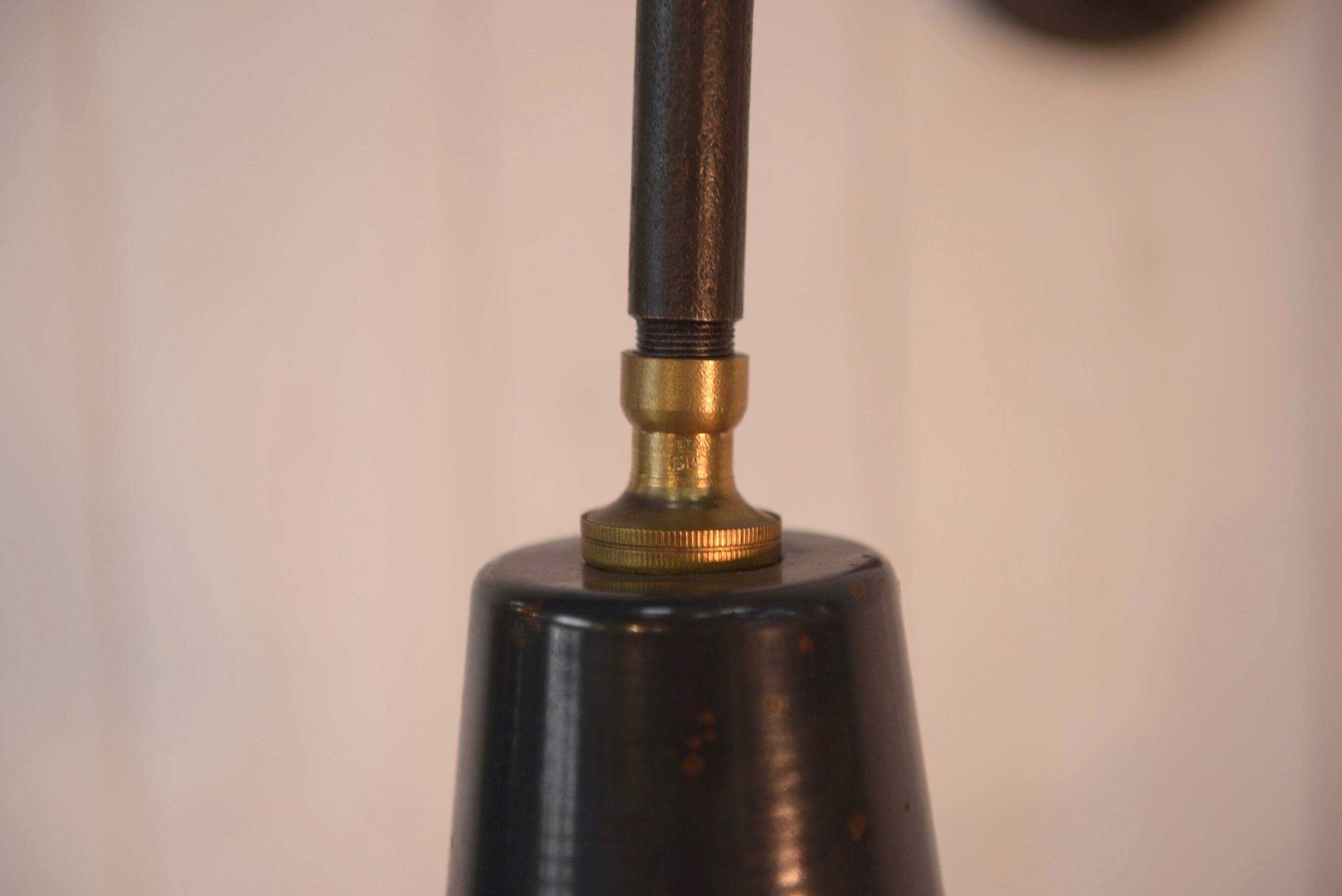 Antique cast iron wall bracket and enamelled globe, 1950s
