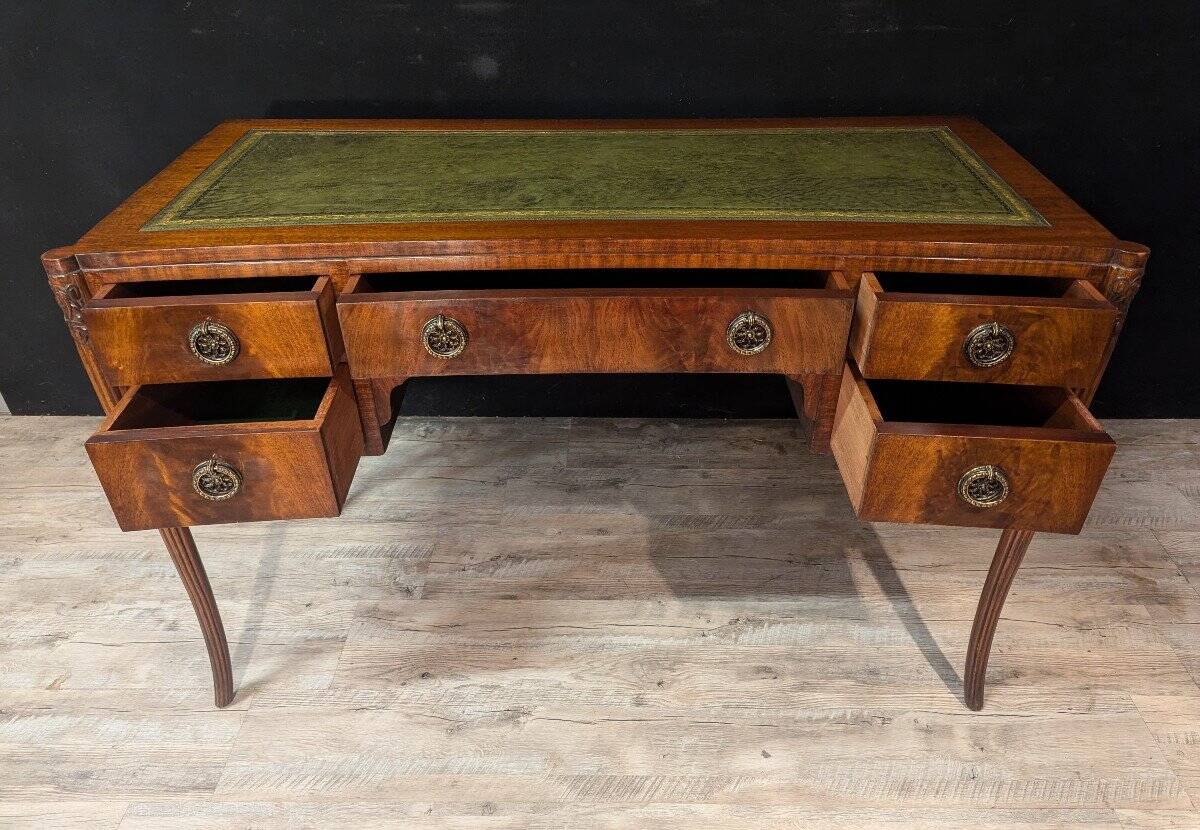 Art Deco desk in curved mahogany veneer.