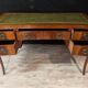 Art Deco desk in curved mahogany veneer.