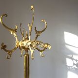 Turning brass coat rack