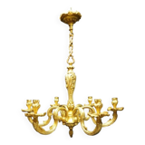Massive bronze chandelier for candles.