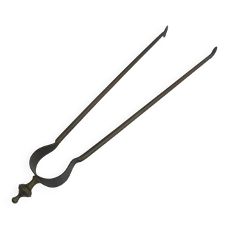 Old brass log clamp for fireplace