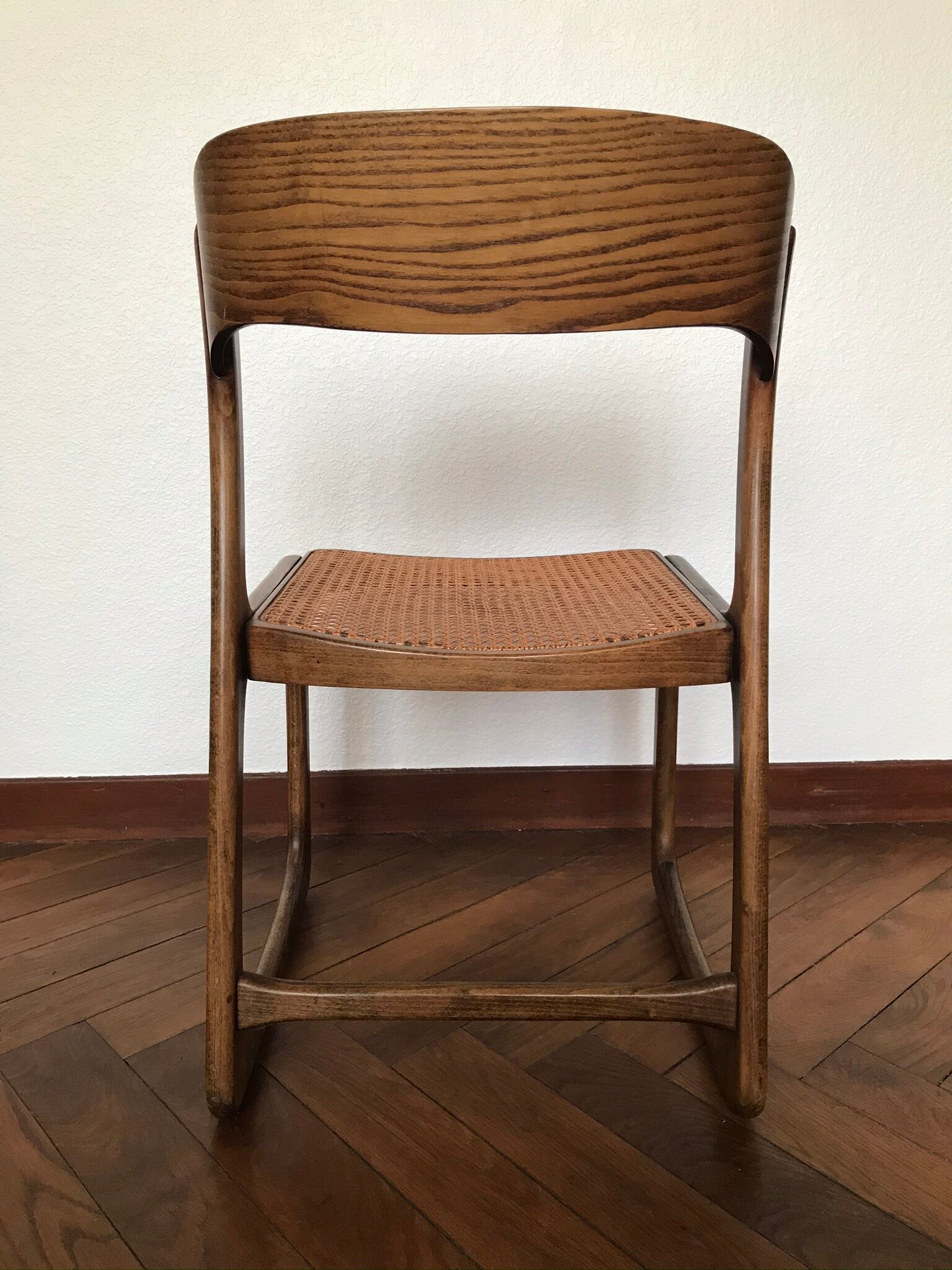 Series of 4 sleigh chairs in wicker, by Baumann