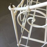 White wrought iron folding bed