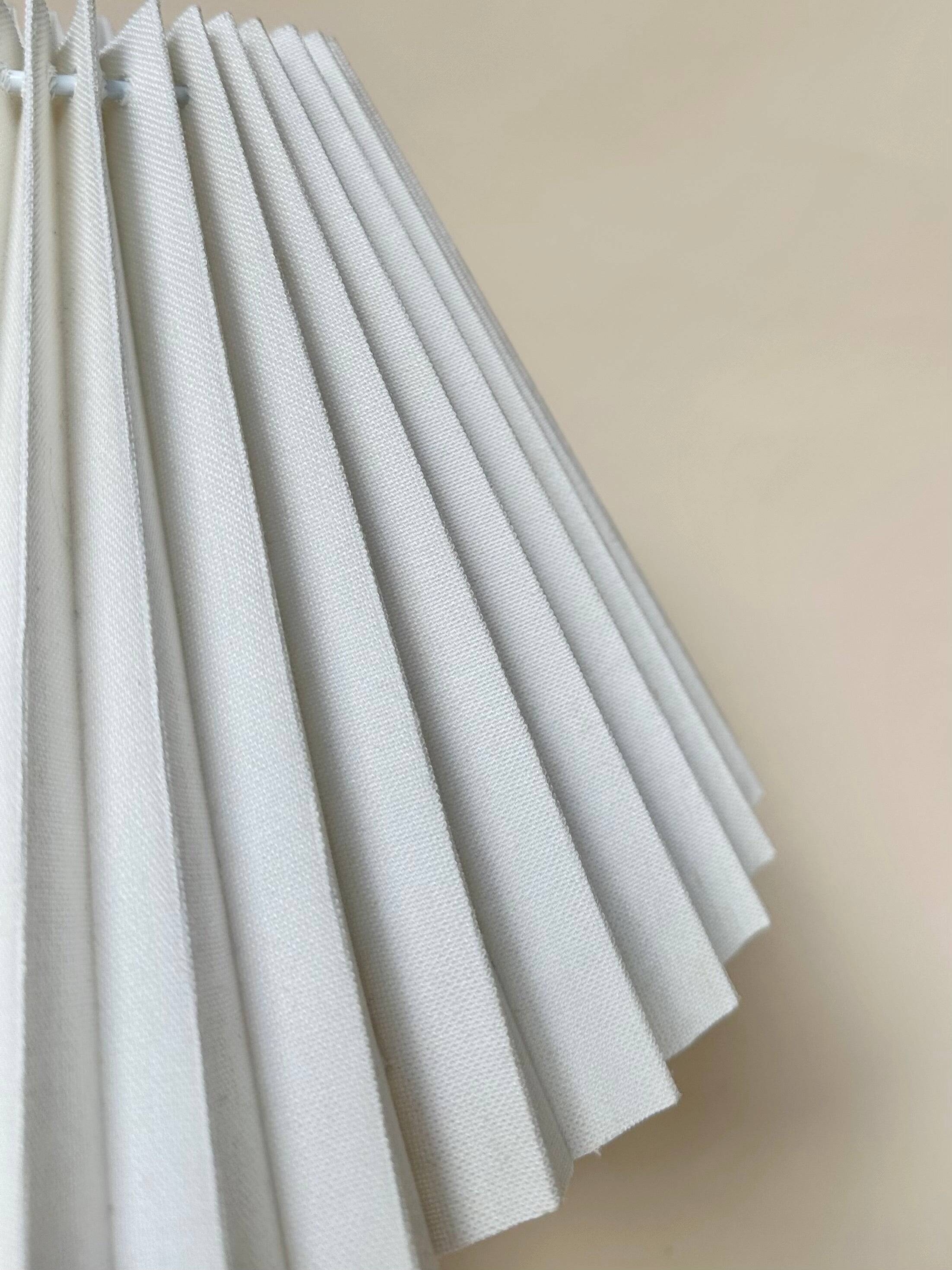 Stone lamp with pleated shade