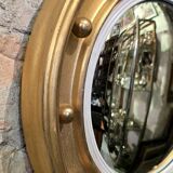 Witch mirror porthole style in gilded wood, diameter 44 cm.