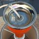 Designer lamp from the 70s in chrome metal and orange lacquered wood