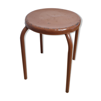 Rust-colored painted metal stool