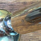 Set of candlesticks and tubular vases in solid brass.
