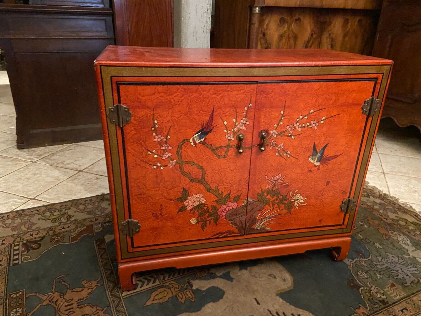 Low sideboard with lacquered decoration with birds on orange background Far East China Japan