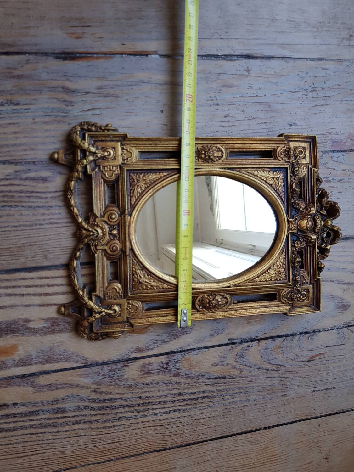 Old small golden mirror