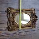 Old small golden mirror
