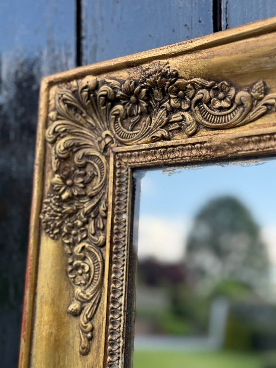 Miroir Empire en bois stuqué et doré, début XIXème siècle