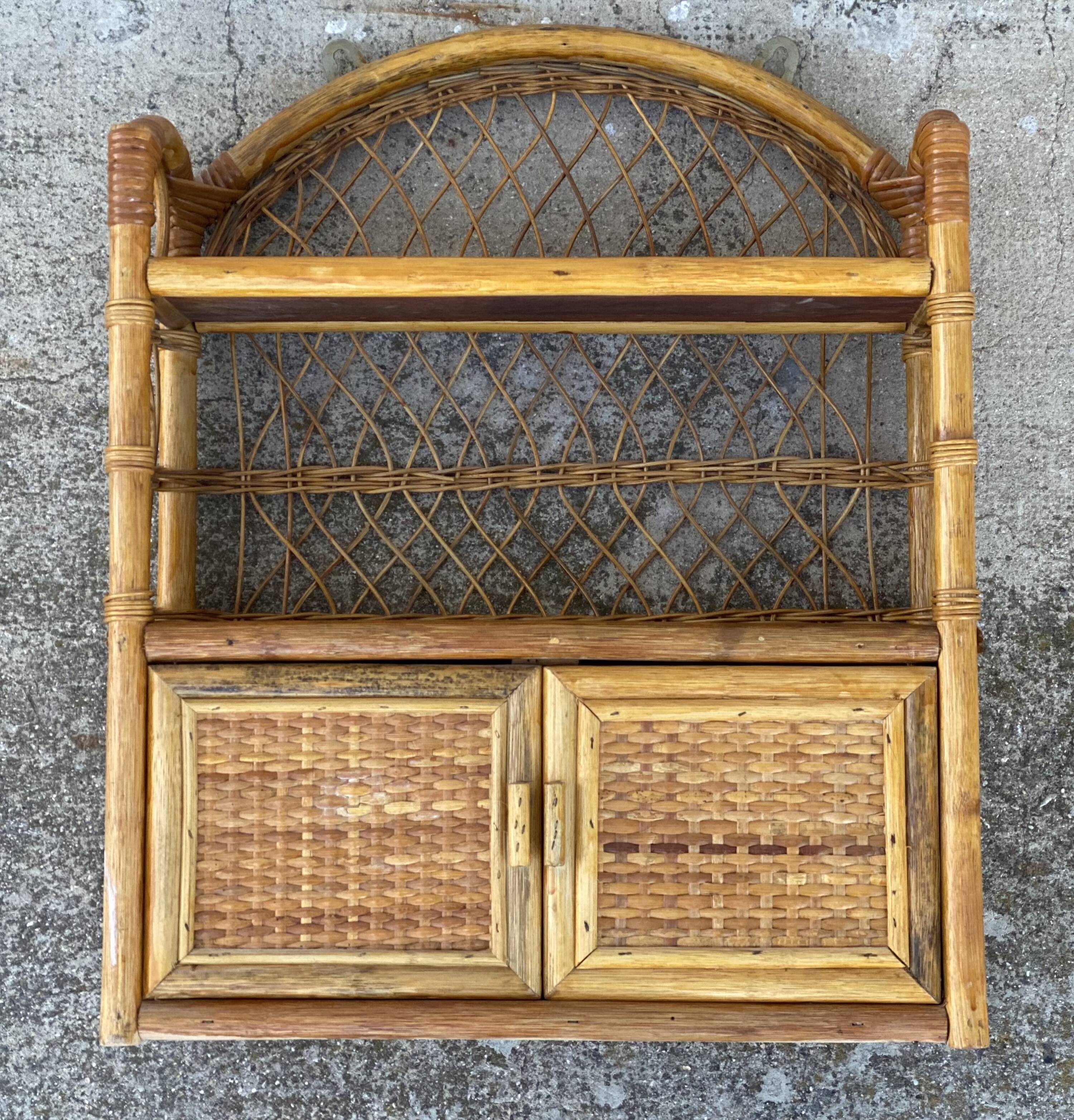 Small vintage 1970s rattan wall shelf with 2 doors.
