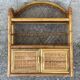 Small vintage 1970s rattan wall shelf with 2 doors.