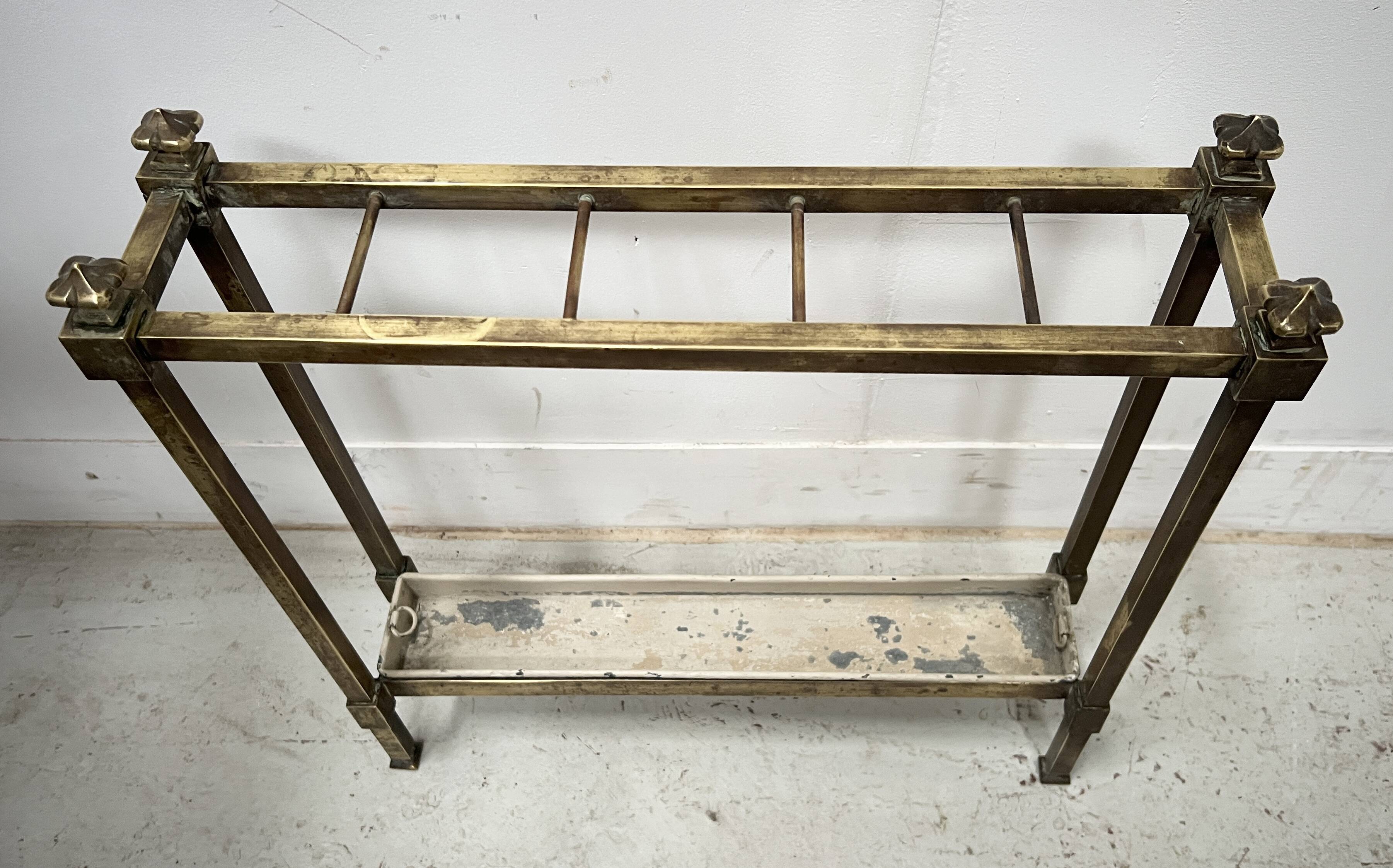 Brass and sheet metal umbrella stands from the 20th century.