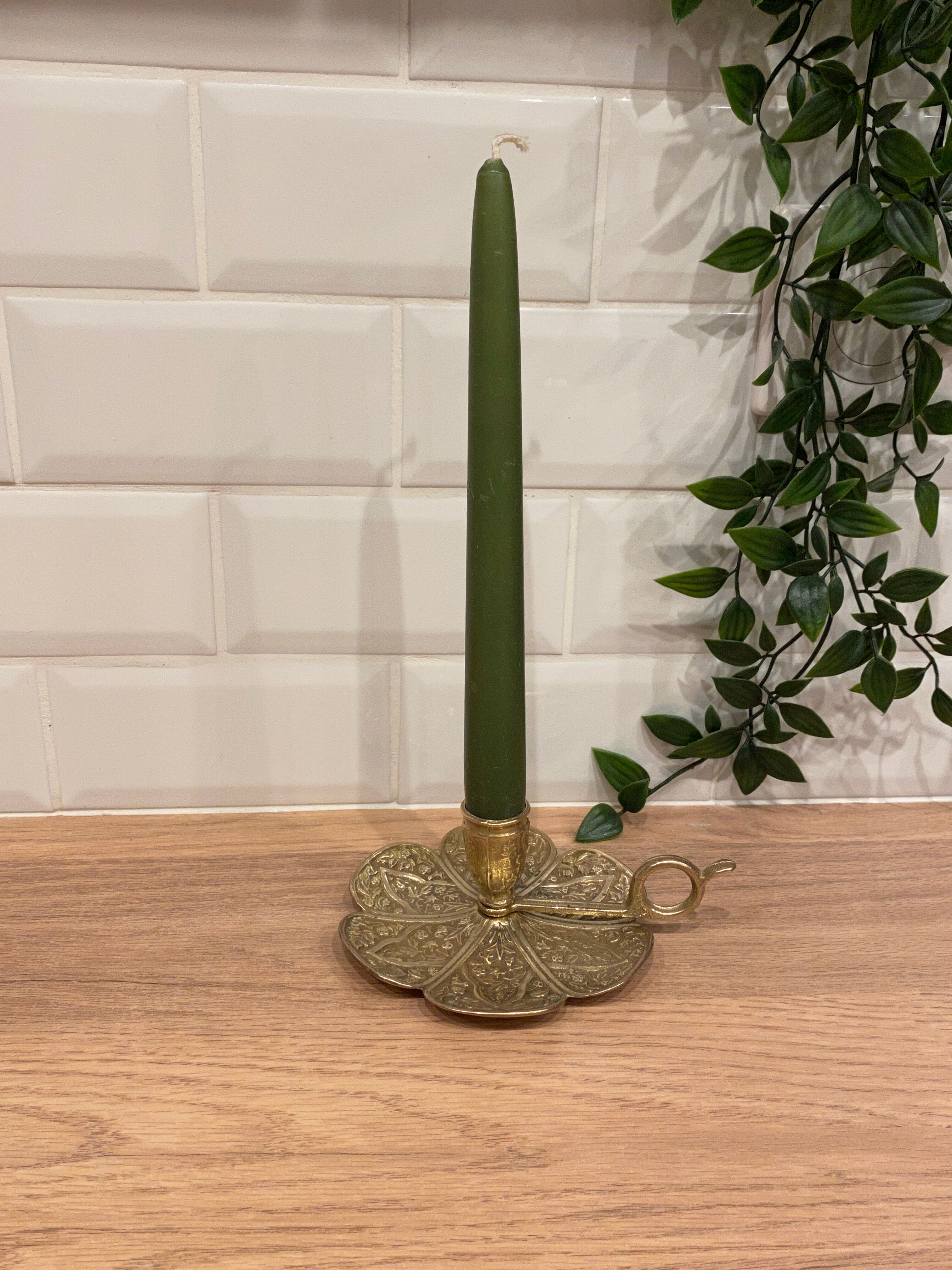 Brass candle holder on frame
