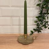 Brass candle holder on frame