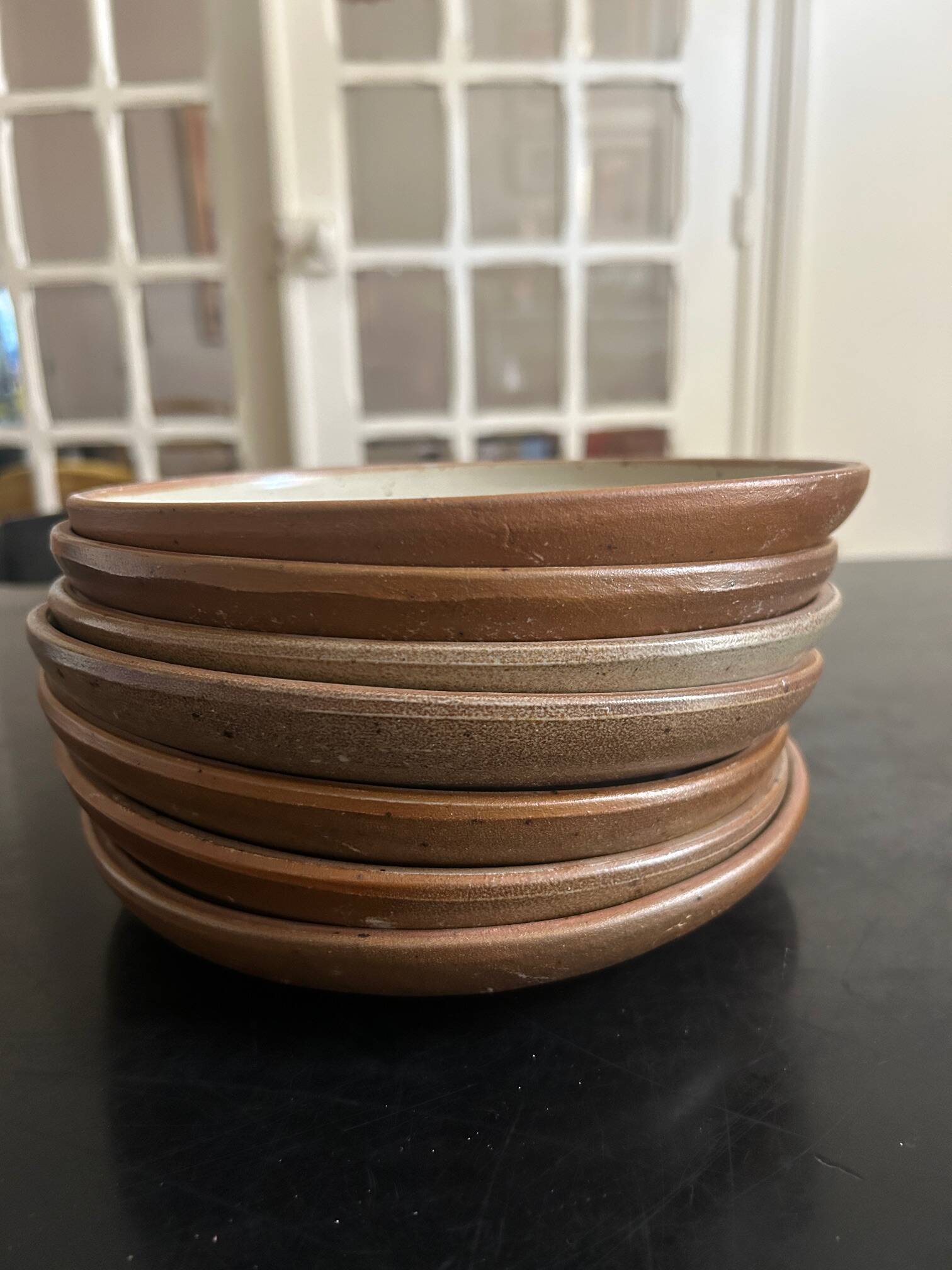 7 stoneware plates 1970