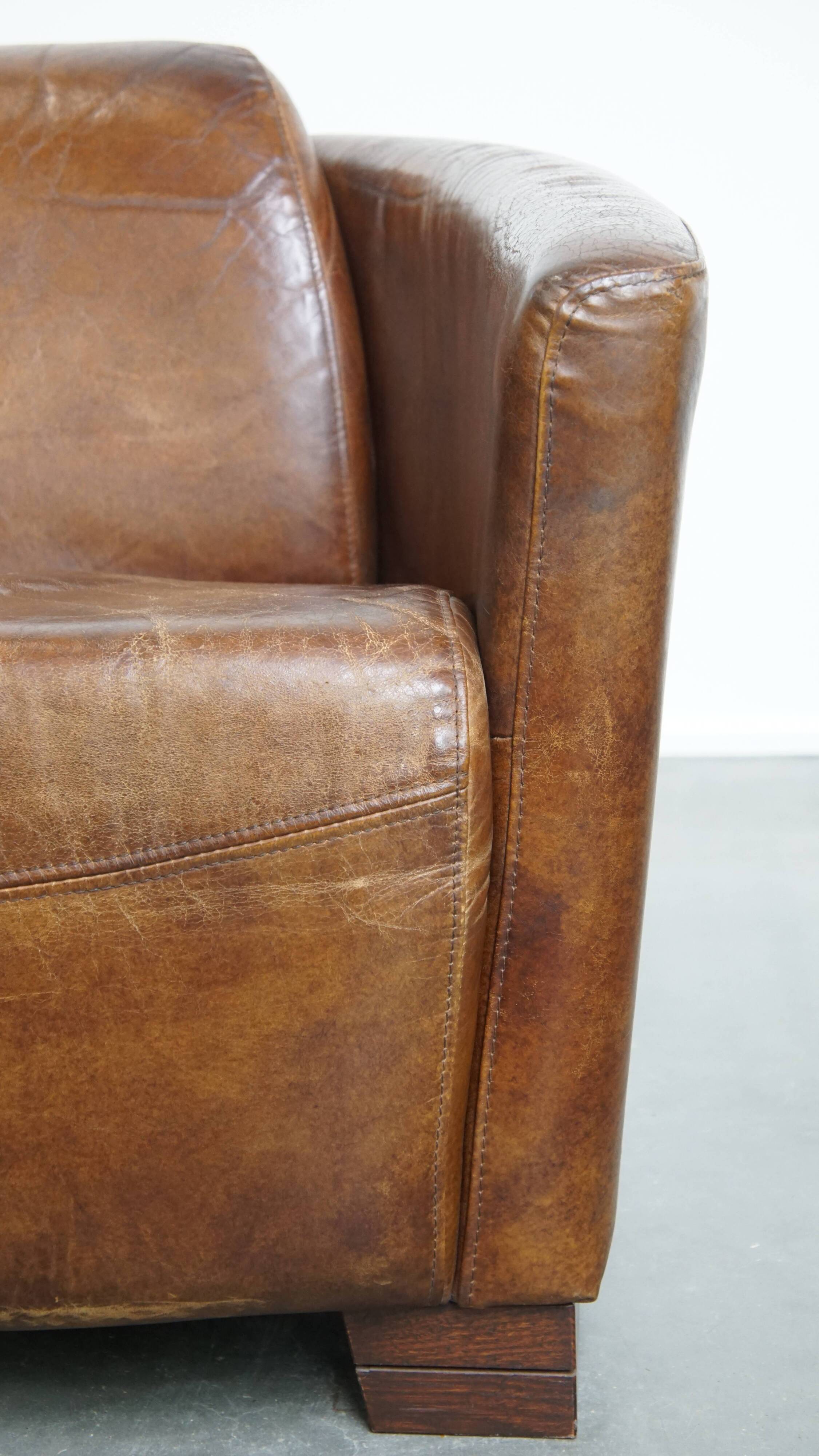 Brown Aviator design armchair made of cowhide leather