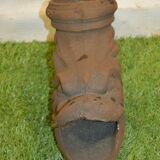 Cast iron gutter downspout in the shape of a dolphin