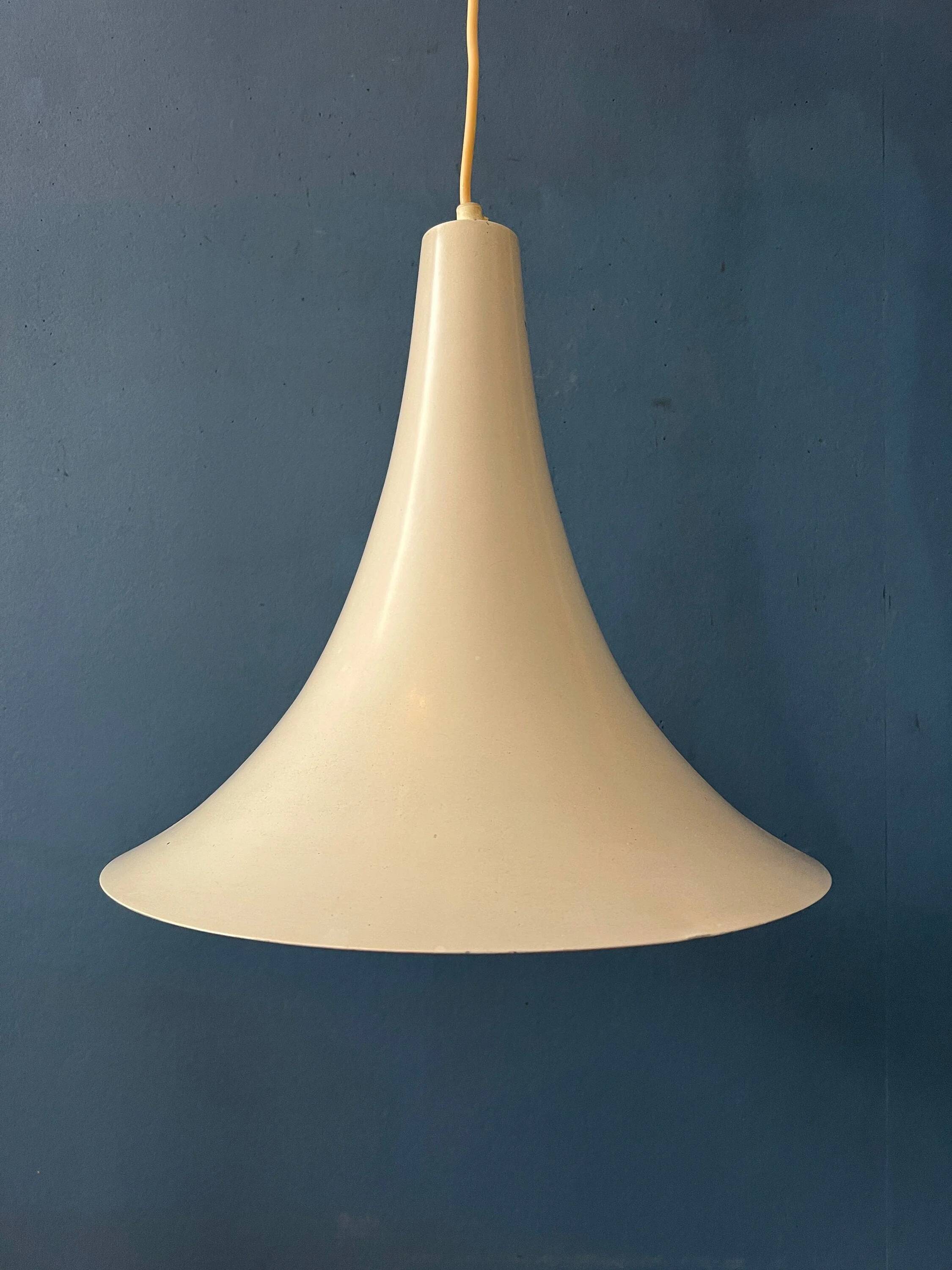Small vintage beige pendant light in the shape of a witch's hat.
