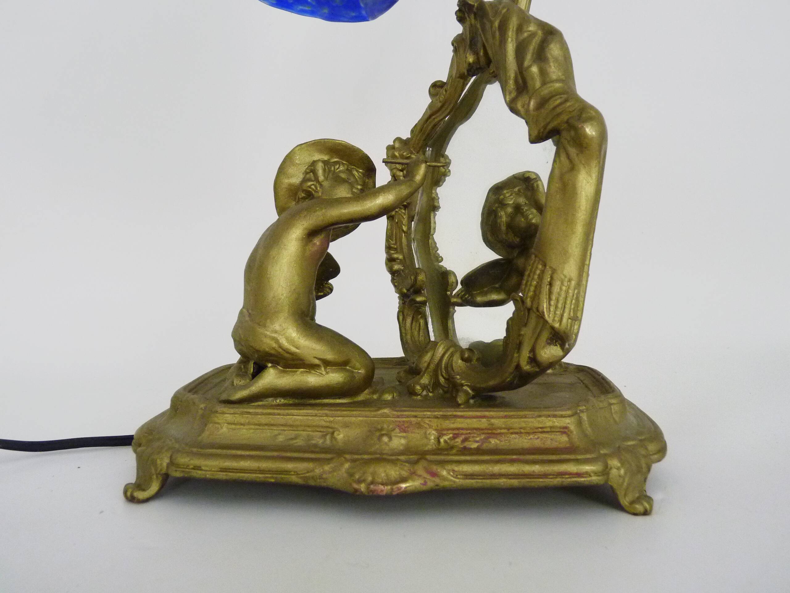 Vintage bronze table lamp featuring a painter on a mirror from the 1960s.