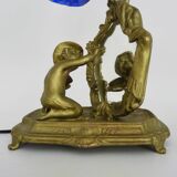 Vintage bronze table lamp featuring a painter on a mirror from the 1960s.