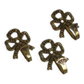 Trio of brass coat hooks