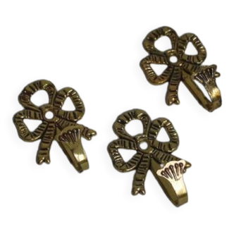 Trio of brass coat hooks