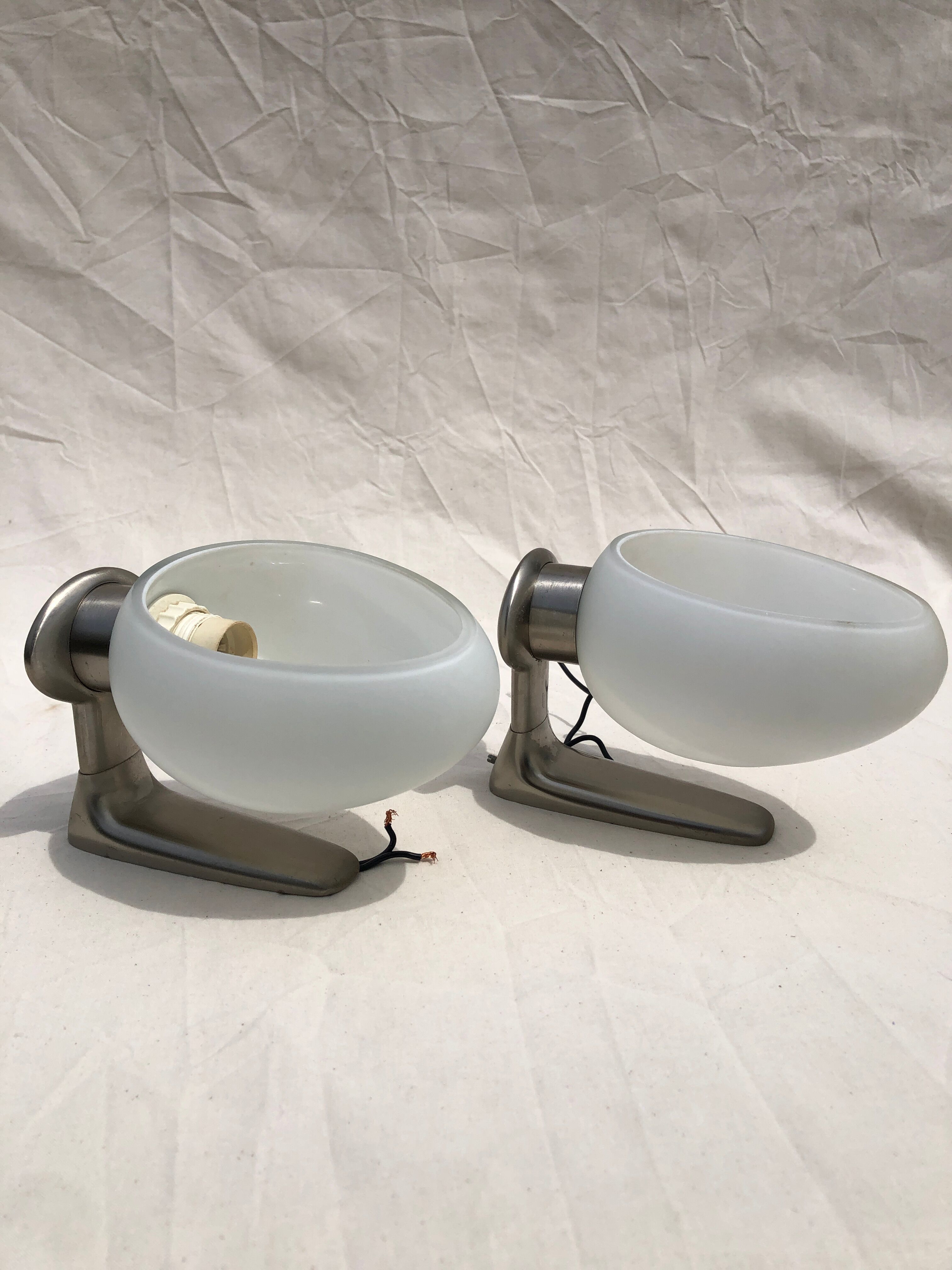 Pair of brushed steel appliques, half-egg opaline, 1970