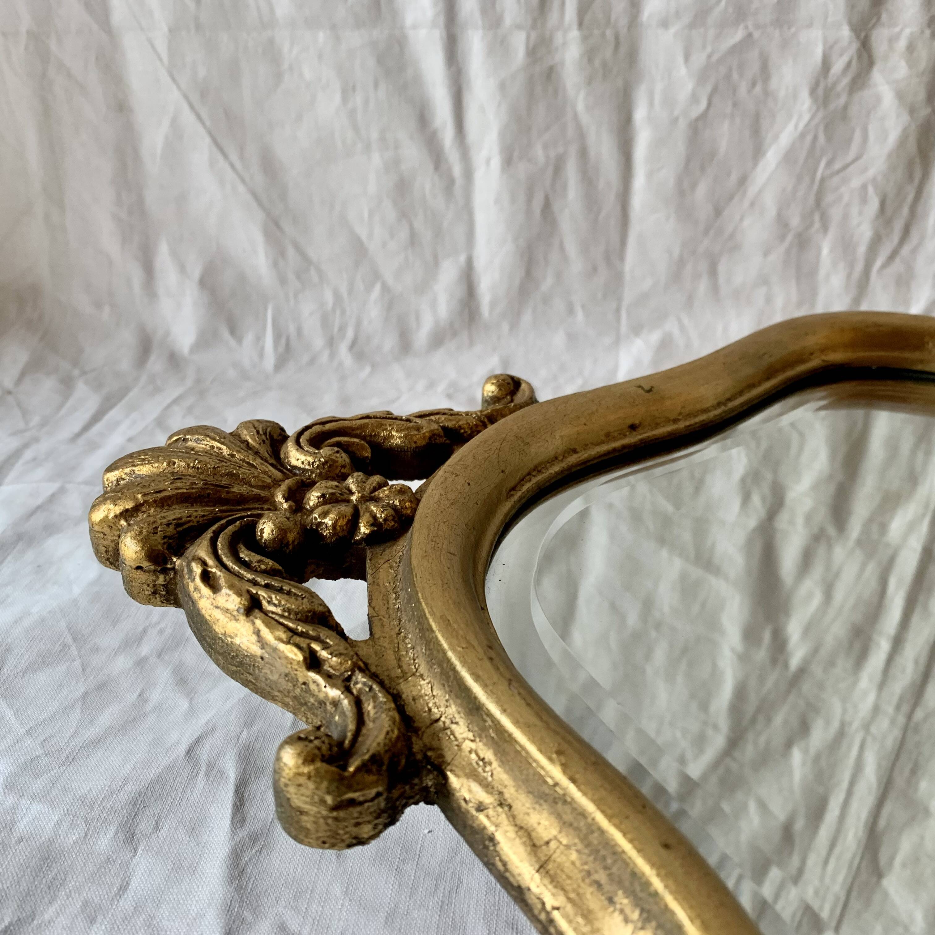 Antique beveled wall mirror in gilded solid wood