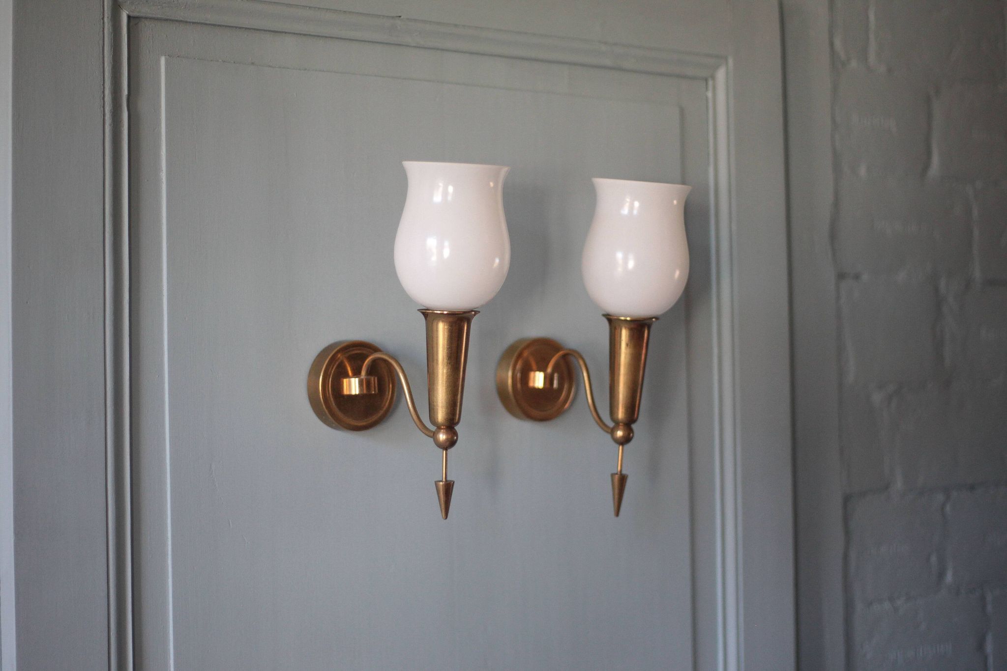 Pair of gold metal and white opaline wall sconces, wall light, sconce.