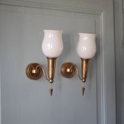 Pair of gold metal and white opaline wall sconces, wall light, sconce.